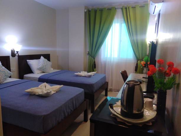 Imagen de la habitación del Hotel Venezia Suites Iloilo. Foto 10