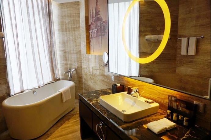 Imagen de la habitación del Hotel Venice Jianguo Dandong. Foto 19