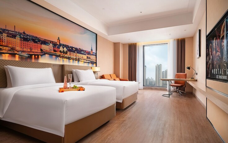 Imagen de la habitación del Hotel Venus International. Foto 11