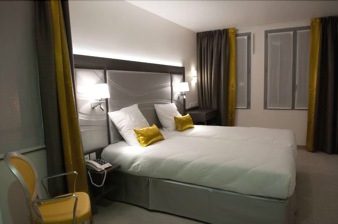 Imagen de la habitación del Hotel Versailles Chantiers. Foto 12