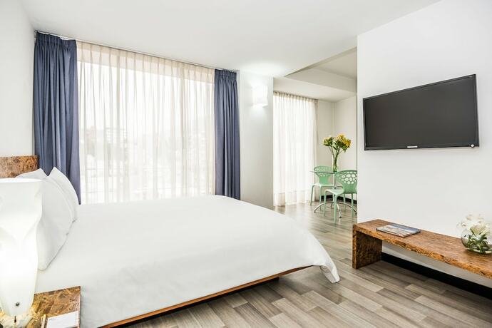 Imagen de la habitación del Hotel Viaggio Studios. Foto 3