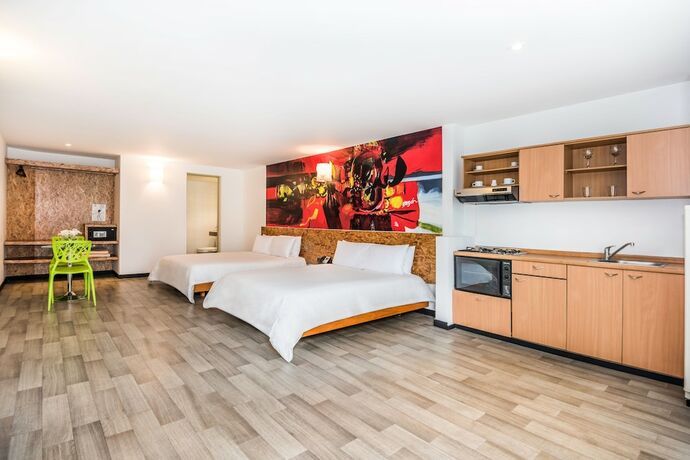 Imagen de la habitación del Hotel Viaggio Studios. Foto 7