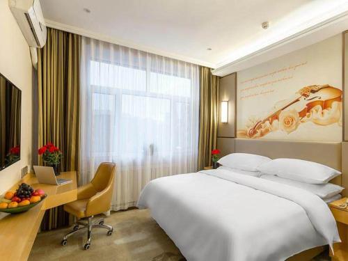 Imagen de la habitación del Hotel Vienna Classic Mudanjiang Railway Station. Foto 9