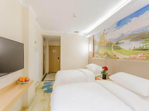 Imagen de la habitación del Hotel Vienna Classic Mudanjiang Railway Station. Foto 11