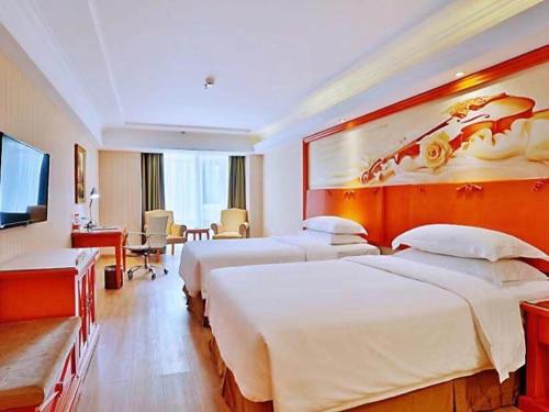 Imagen de la habitación del Hotel Vienna Harbin West Railway Station Wanda Plaza. Foto 16