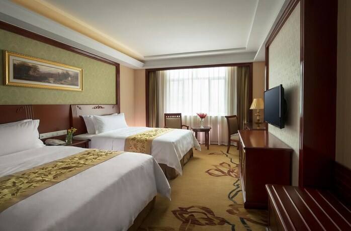 Imagen de la habitación del Hotel Vienna Hotel. Foto 8