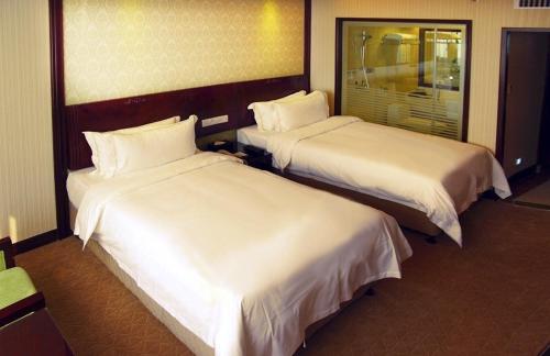 Imagen de la habitación del Hotel Vienna International - Hangzhou Wulin Square. Foto 7