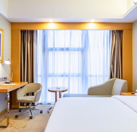 Imagen de la habitación del Hotel Vienna International Hotel Wuyi Square. Foto 2