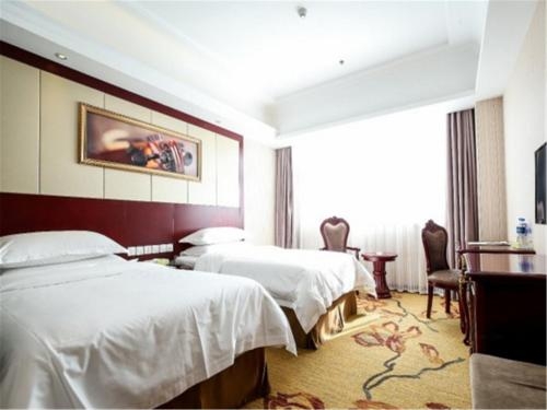 Imagen de la habitación del Hotel Vienna International Hotel(National Exhibition and Convention Center & West Tianshan Road). Foto 9