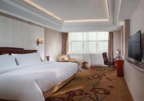 Imagen de la habitación del Hotel Vienna International Jiangsu Wuxi Taihu Expo Center. Foto 17