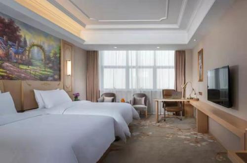 Imagen de la habitación del Hotel Vienna International Jiangsu Wuxi Taihu Expo Center. Foto 18