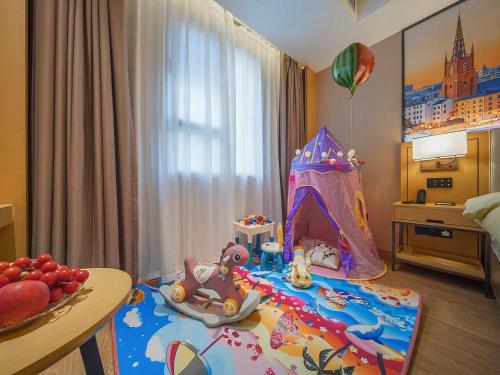 Imagen de la habitación del Hotel Vienna International Kunming longquan road Finance University. Foto 19