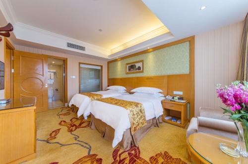 Imagen de la habitación del Hotel Vienna International Lijiang Yuxue Avenue. Foto 9