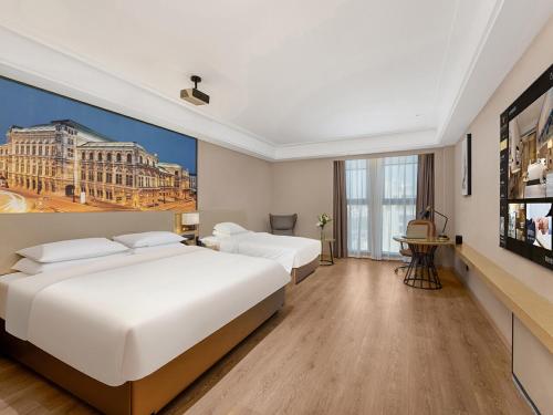 Imagen de la habitación del Hotel Vienna International Linqu Wanda Plaza. Foto 12