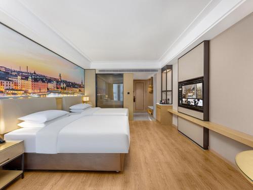 Imagen de la habitación del Hotel Vienna International Linqu Wanda Plaza. Foto 13