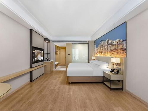 Imagen de la habitación del Hotel Vienna International Linqu Wanda Plaza. Foto 15