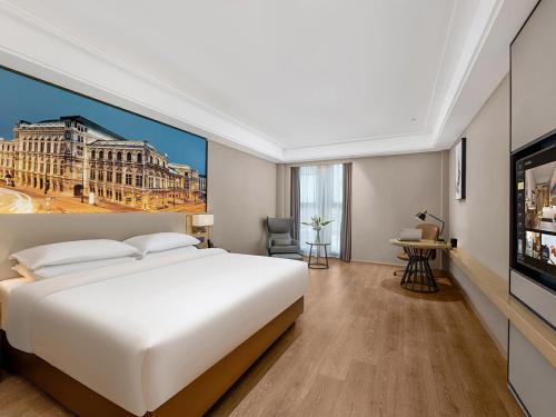 Imagen de la habitación del Hotel Vienna International Linqu Wanda Plaza. Foto 16