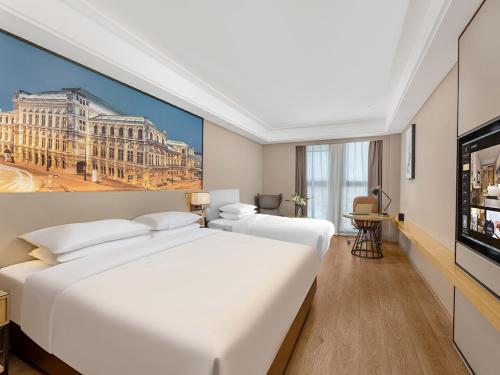 Imagen de la habitación del Hotel Vienna International Linqu Wanda Plaza. Foto 17