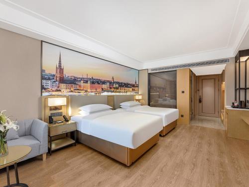 Imagen de la habitación del Hotel Vienna International Linqu Wanda Plaza. Foto 18