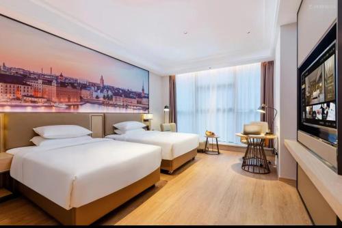 Imagen de la habitación del Hotel Vienna International - Shenzhen Baolong Metro Station. Foto 19