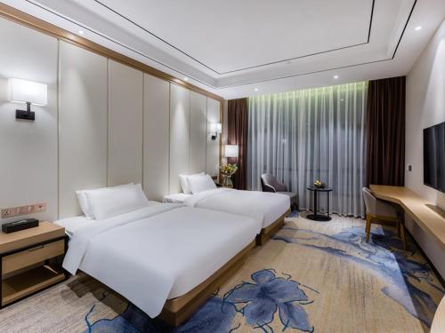 Imagen de la habitación del Hotel Vienna International Xiamen University. Foto 7