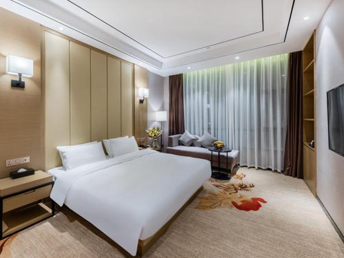 Imagen de la habitación del Hotel Vienna International Xiamen University. Foto 12