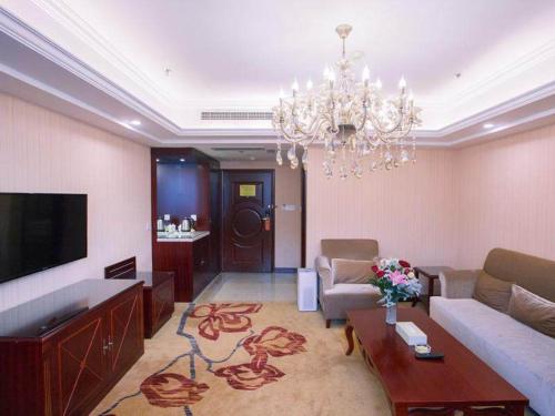 Imagen de la habitación del Hotel Vienna International Yangzhou outlets Plaza Heyuan. Foto 9