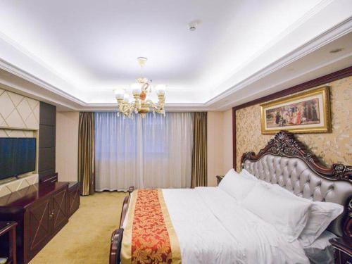 Imagen de la habitación del Hotel Vienna International Yangzhou outlets Plaza Heyuan. Foto 14