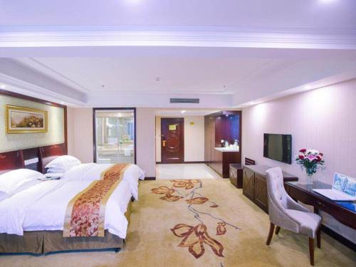 Imagen de la habitación del Hotel Vienna International Yangzhou outlets Plaza Heyuan. Foto 15