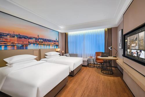 Imagen de la habitación del Hotel Vienna International Yichun Wanzai Guomao Branch. Foto 19