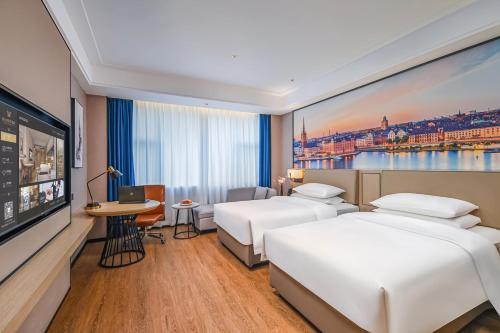 Imagen general del Hotel Vienna International Yichun Wanzai Guomao Branch. Foto 5