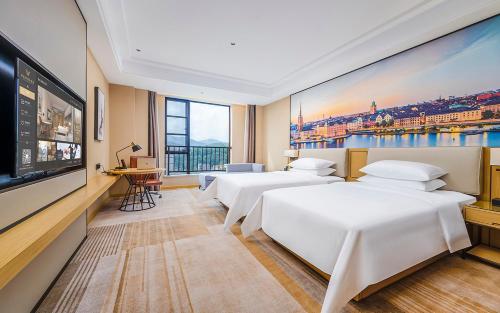 Imagen de la habitación del Hotel Vienna International - Yunfu Century Avenue. Foto 20