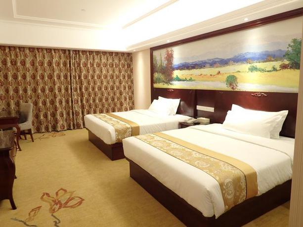 Imagen de la habitación del Hotel Vienna International Zhoupu Wanda Plaza. Foto 5