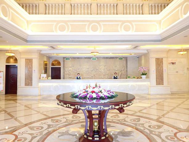 Imagen de la habitación del Hotel Vienna International Zhoupu Wanda Plaza. Foto 7
