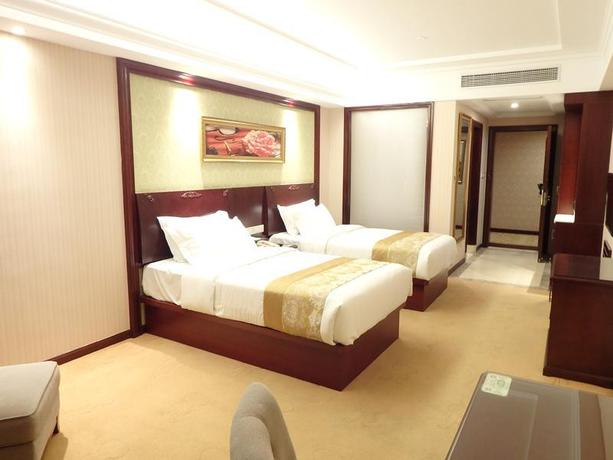 Imagen de la habitación del Hotel Vienna International Zhoupu Wanda Plaza. Foto 9