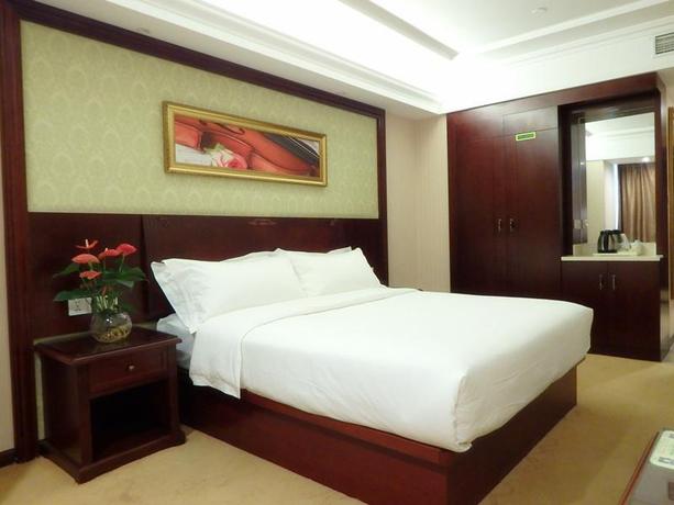 Imagen de la habitación del Hotel Vienna International Zhoupu Wanda Plaza. Foto 11