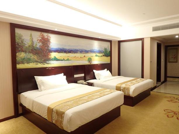 Imagen de la habitación del Hotel Vienna International Zhoupu Wanda Plaza. Foto 12