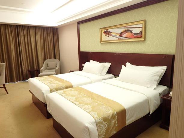 Imagen de la habitación del Hotel Vienna International Zhoupu Wanda Plaza. Foto 13