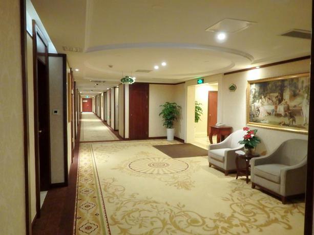 Imagen de la habitación del Hotel Vienna International Zhoupu Wanda Plaza. Foto 14
