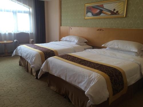 Imagen de la habitación del Hotel Vienna Qidong South Gongyuan Road. Foto 10