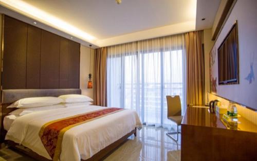 Imagen de la habitación del Hotel Vienna Sanya Sanya Bay. Foto 9