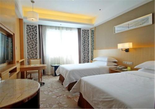 Imagen de la habitación del Hotel Vienna Waigaoqiao. Foto 6