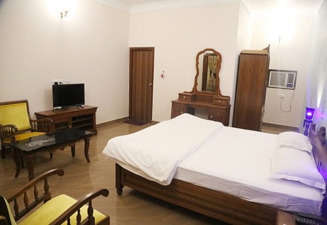 Imagen de la habitación del Hotel Vijaigarh kothi. Foto 13
