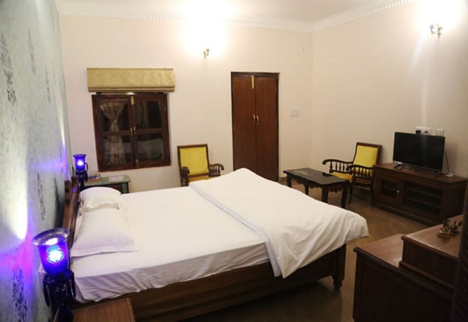Imagen de la habitación del Hotel Vijaigarh kothi. Foto 14