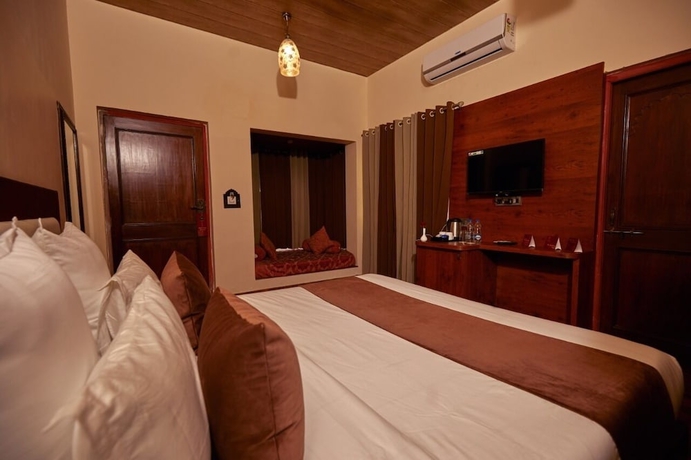Imagen de la habitación del Hotel Vijay Garh Resort Udaipur. Foto 14