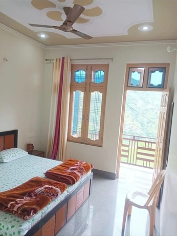 Imagen de la habitación del Hotel Vijay Residency Barkot. Foto 11