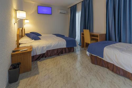 Imagen de la habitación del Hotel Vila Calella. Foto 18