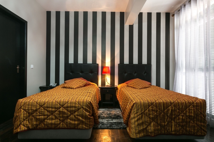 Imagen de la habitación del Hotel Vila Camacho Guest House. Foto 10