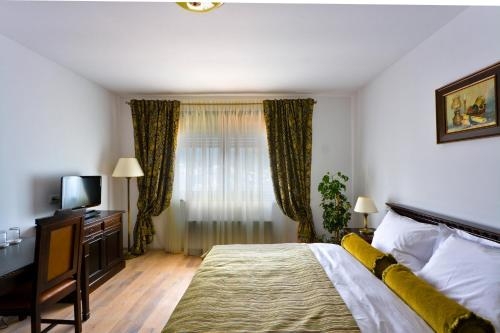 Imagen de la habitación del Hotel Vila Leonida. Foto 8