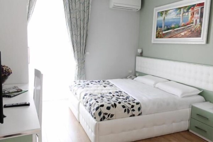 Imagen de la habitación del Hotel Vila Verde City Center. Foto 17